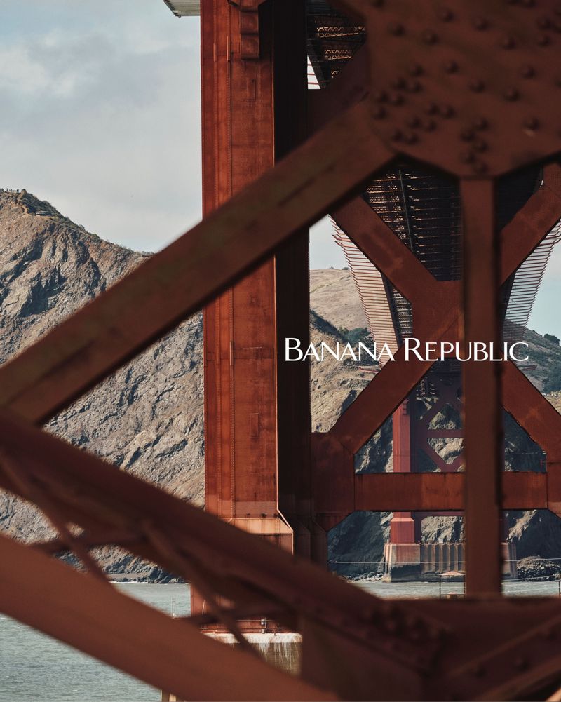 Golden Gate Bridge structure in San Francisco, California, with mountain and Banana Republic logo in a landscape orientation.