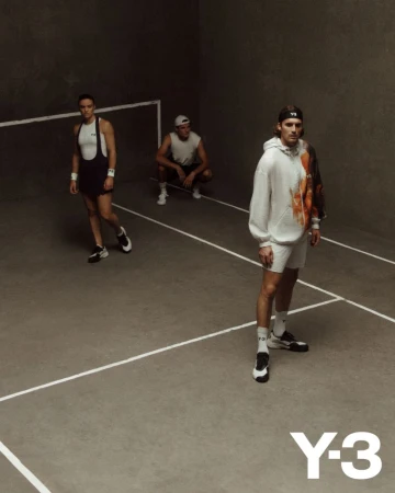 Three men in sportswear pose indoors on a grey court with white lines, showcasing a Y-3 branded sweatshirt and athletic wear.