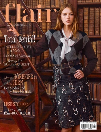 Fashion magazine cover featuring a fair-skinned woman with a diamond-pattern sweater and a leather skirt against a bookshelf background.