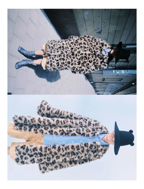 Fashionable person in an animal-print coat and hat, standing on concrete, mirrored in the lower half of the image for a surreal effect.