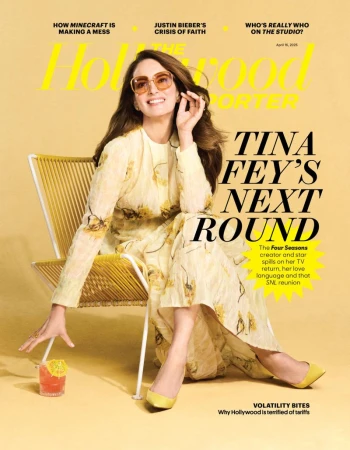 Magazine cover of The Hollywood Reporter featuring Tina Fey sitting in a yellow chair with a cocktail in a studio setting with yellow backdrop.