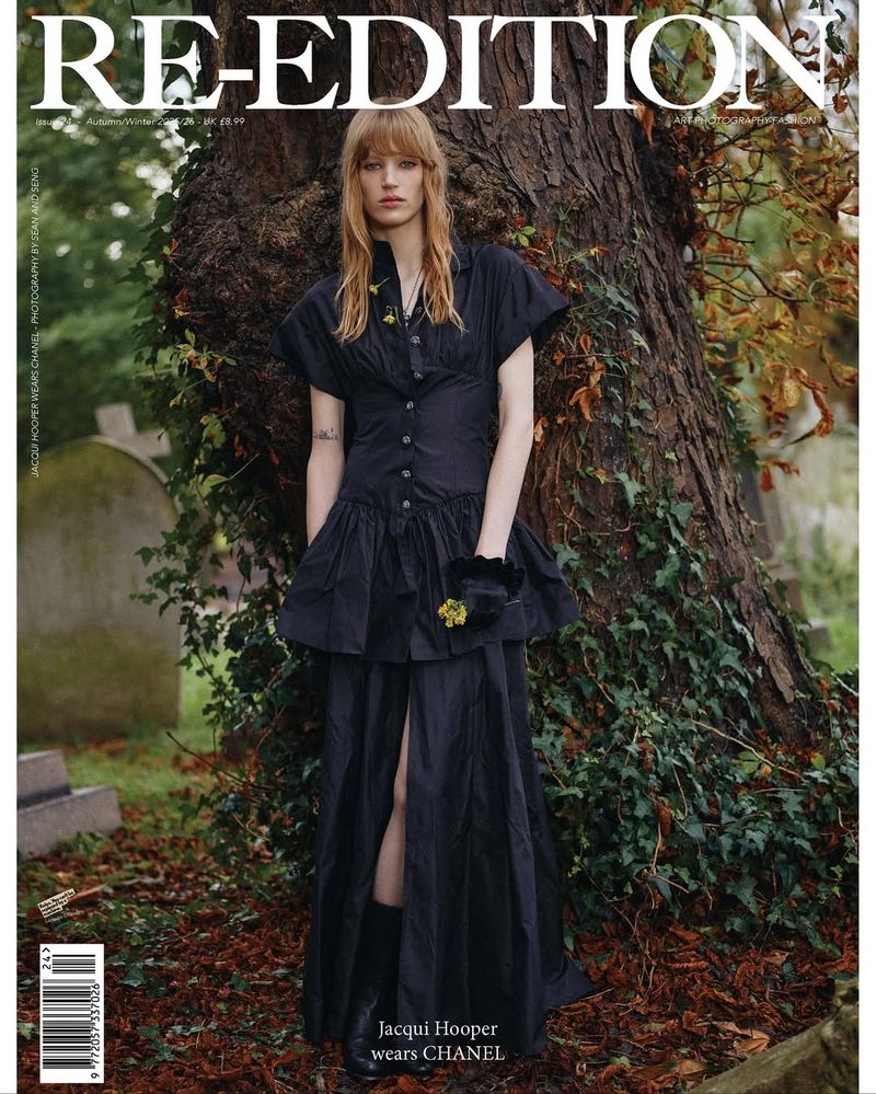 Magazine cover featuring a blonde model wearing a black dress, posing in a cemetery with a tree. Editorial fashion shot.