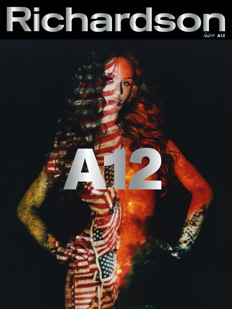 Magazine cover featuring a model with long hair, partially covered in an American flag pattern, posing against a dark background.