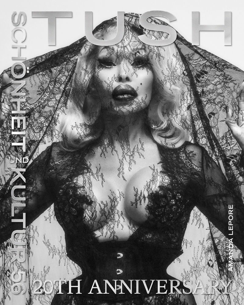 Magazine cover featuring a woman with platinum blonde hair wearing a black lace veil and corset, showcasing a striking and artistic portrait.