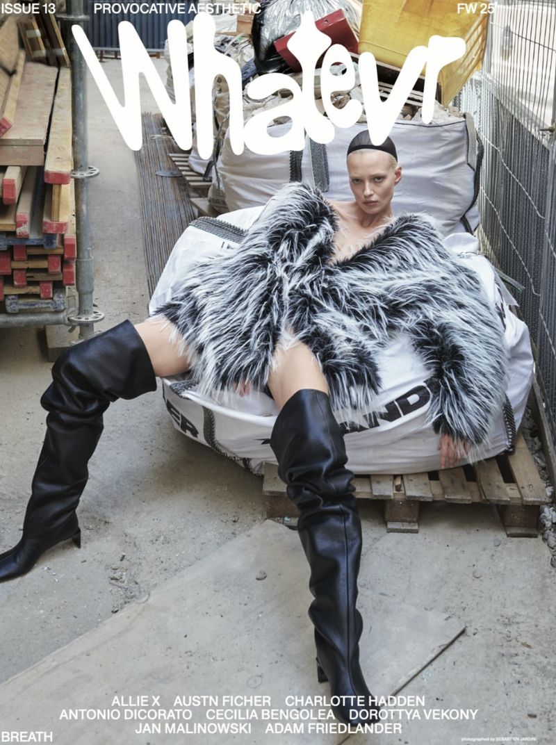 Fashion magazine cover featuring a woman in a fur coat and leather boots, sitting on a construction bag with a grey urban background.