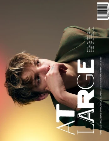 Fashion magazine cover featuring a young adult man in a green jacket, looking at the camera with an intense expression, against a gradient background.