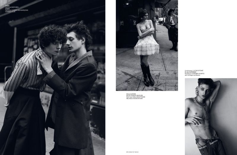 Black-and-white fashion editorial with two men in jackets and shirts, a woman in a dress, and a shirtless man with jewelry.