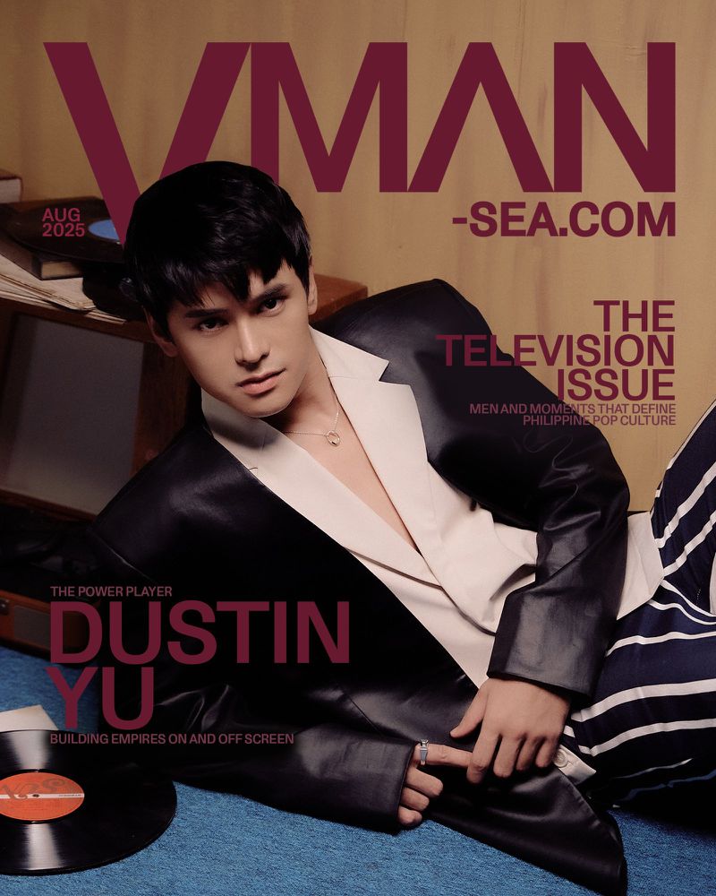 Magazine cover featuring Dustin Yu in a black blazer and white shirt, with bold text overlay and a vintage record, showcasing a stylish editorial layout.