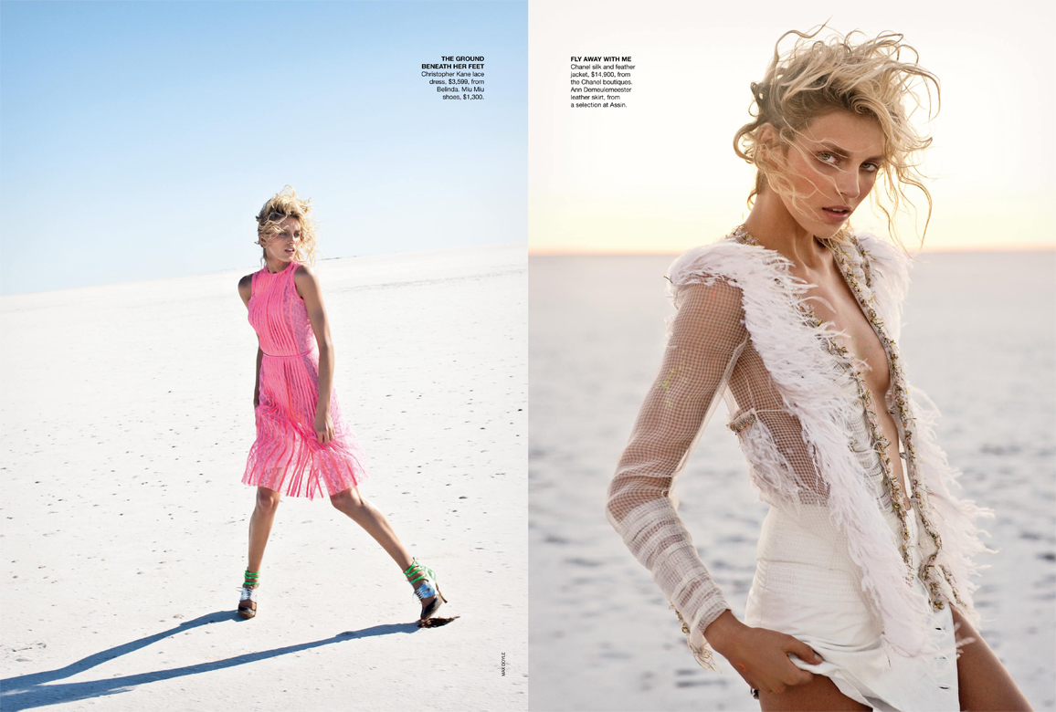 Fashion editorial shot of a blonde model wearing a pink dress on a white sandy beach, contrasted with a model in a white outfit.