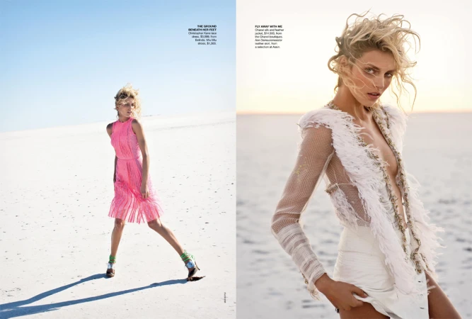 Fashion editorial shot of a blonde model wearing a pink dress on a white sandy beach, contrasted with a model in a white outfit.