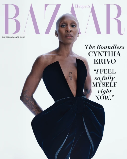 Cynthia Erivo on Harper's Bazaar cover. Black strapless formal dress, shaved head. Magazine cover with Bazaar logo in lavender.