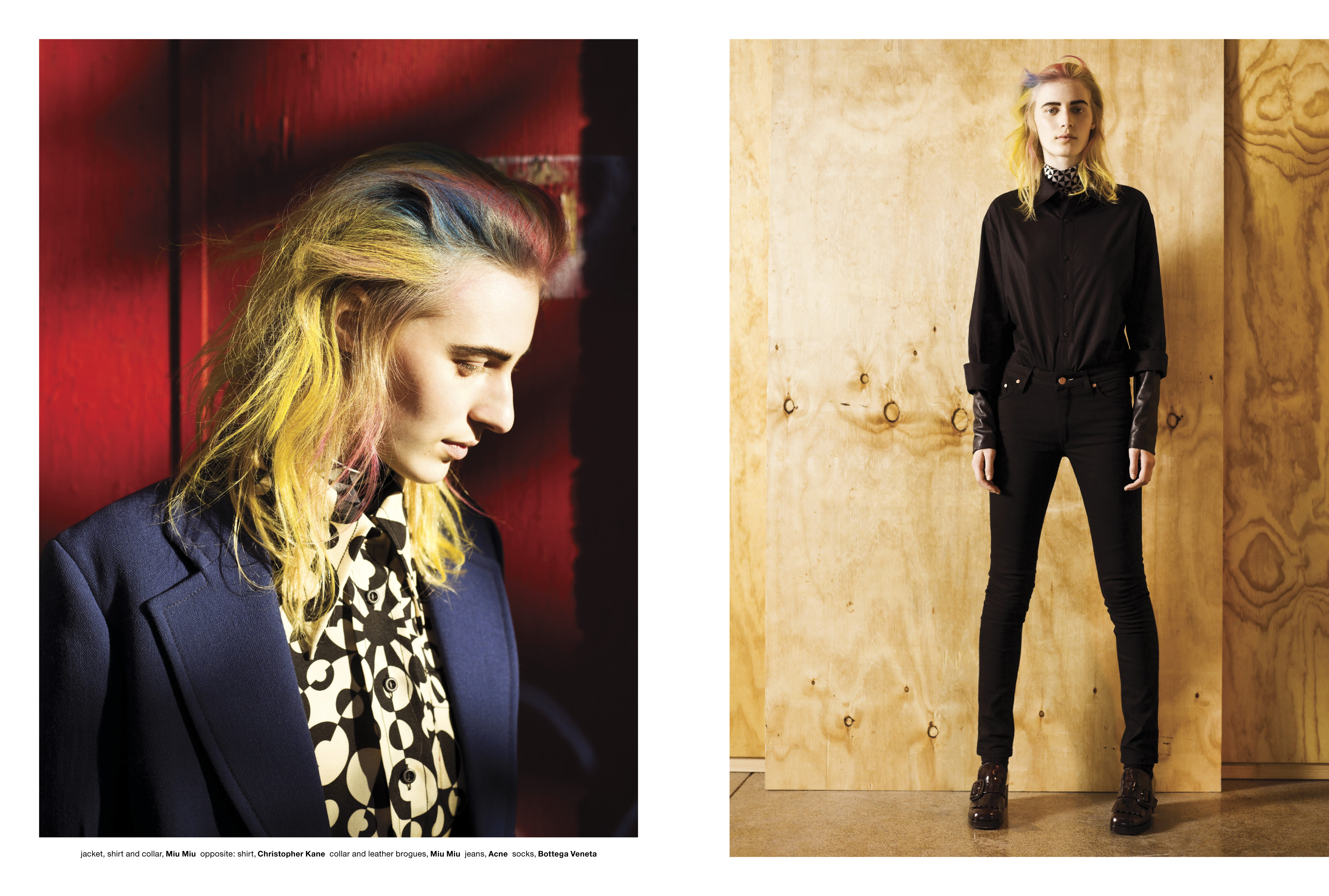 Fashion editorial featuring a young adult wearing a black shirt with colorful hair, posing in front of a wooden backdrop and red wall.