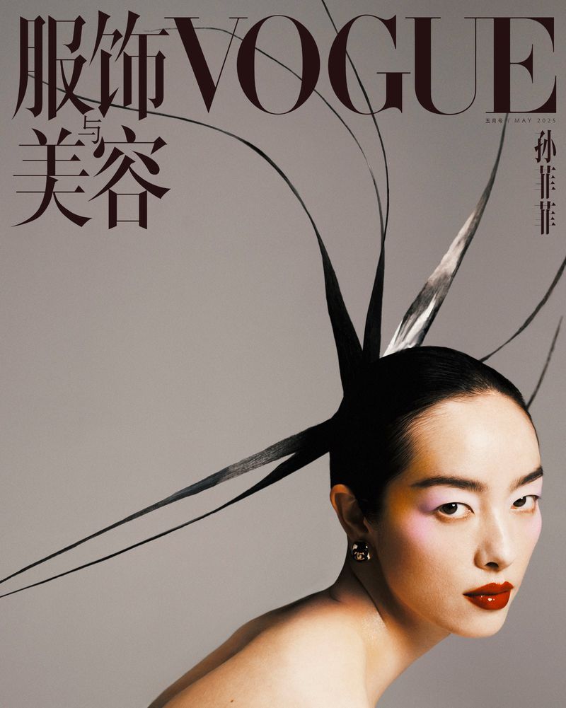 Vogue magazine cover featuring an Asian woman with sleek black hair styled with tendrils, bold red lipstick, and pink eyeshadow.