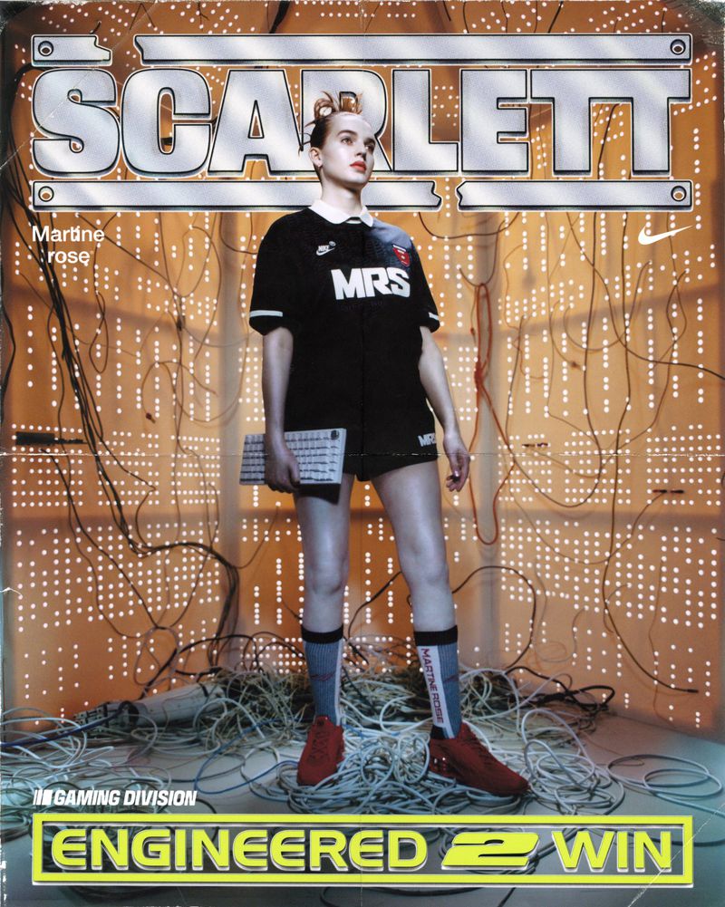 Magazine cover featuring a person holding a keyboard in front of a wall of lights and tangled wires, wearing a sports jersey and shorts.