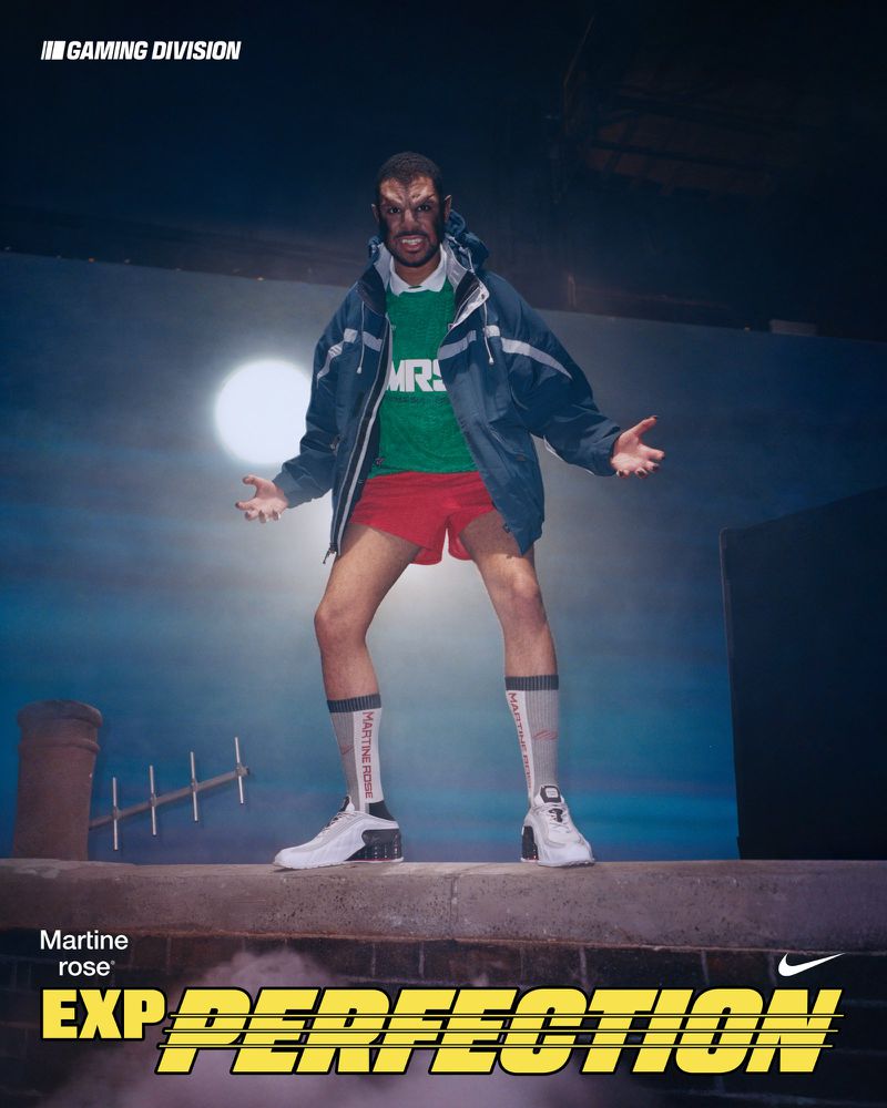 Martine Rose presents the Nike EXP. Perfection: a model in a jacket and shorts poses on a rooftop against a night sky with a moon.