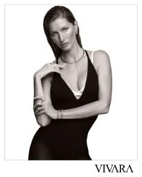 Black and white studio portrait of Gisele Bündchen wearing a black plunge bodysuit and fine jewelry for Vivara.