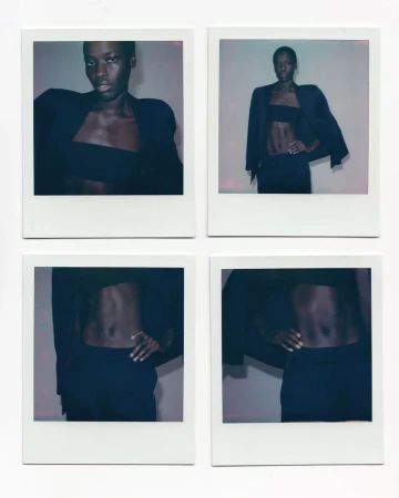 Four polaroid photos featuring an African-American fashion model wearing a black blazer and matching tube top and pants against a neutral backdrop.