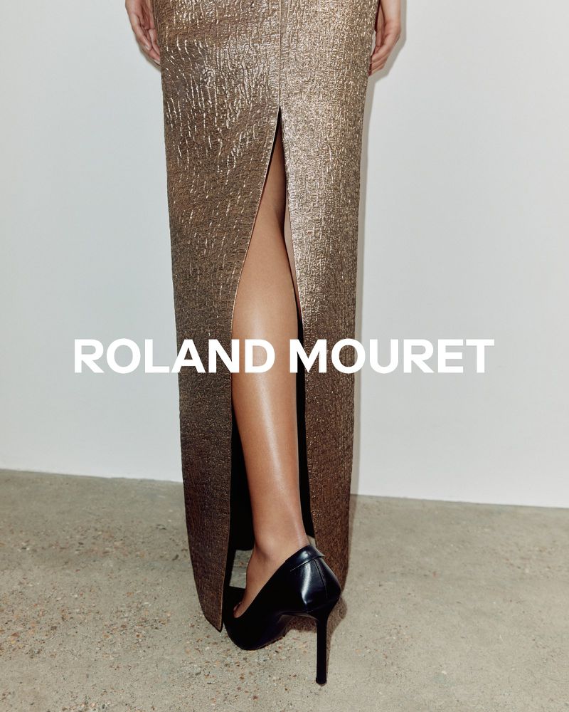 Fashionable bronze gown with thigh-high slit paired with black high heels, showcasing a blend of elegance and modern design.