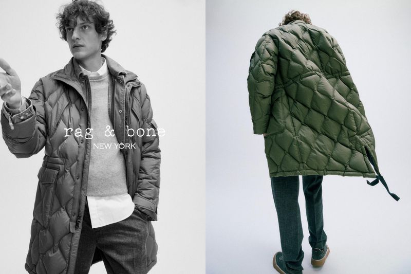 Fashion shot of a man wearing a quilted coat and gray pants in a studio. The logo rag & bone NEW YORK is visible.