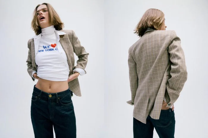 Model wearing a beige plaid blazer, cropped white graphic turtleneck, and dark jeans shown from front and rear angles.