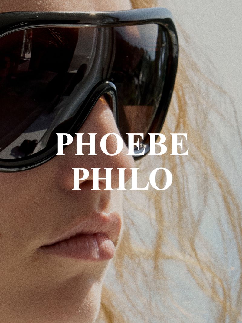 Close-up of an adult wearing oversized sunglasses with text overlay 'Phoebe Philo', capturing a fashion-forward aesthetic.