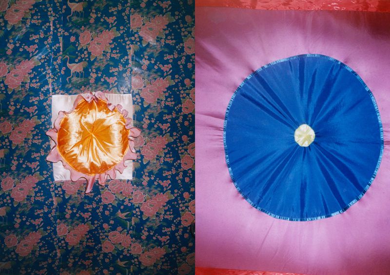 Two vibrant textile artworks featuring colorful fabric and floral patterns, creating a visually striking and textured surface design.