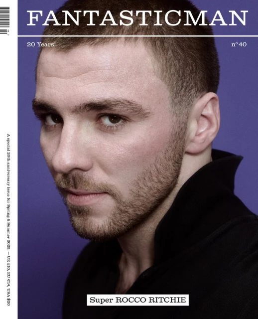 Portrait of Rocco Ritchie on magazine cover with violet background, featuring his head and shoulders in black collared shirt.