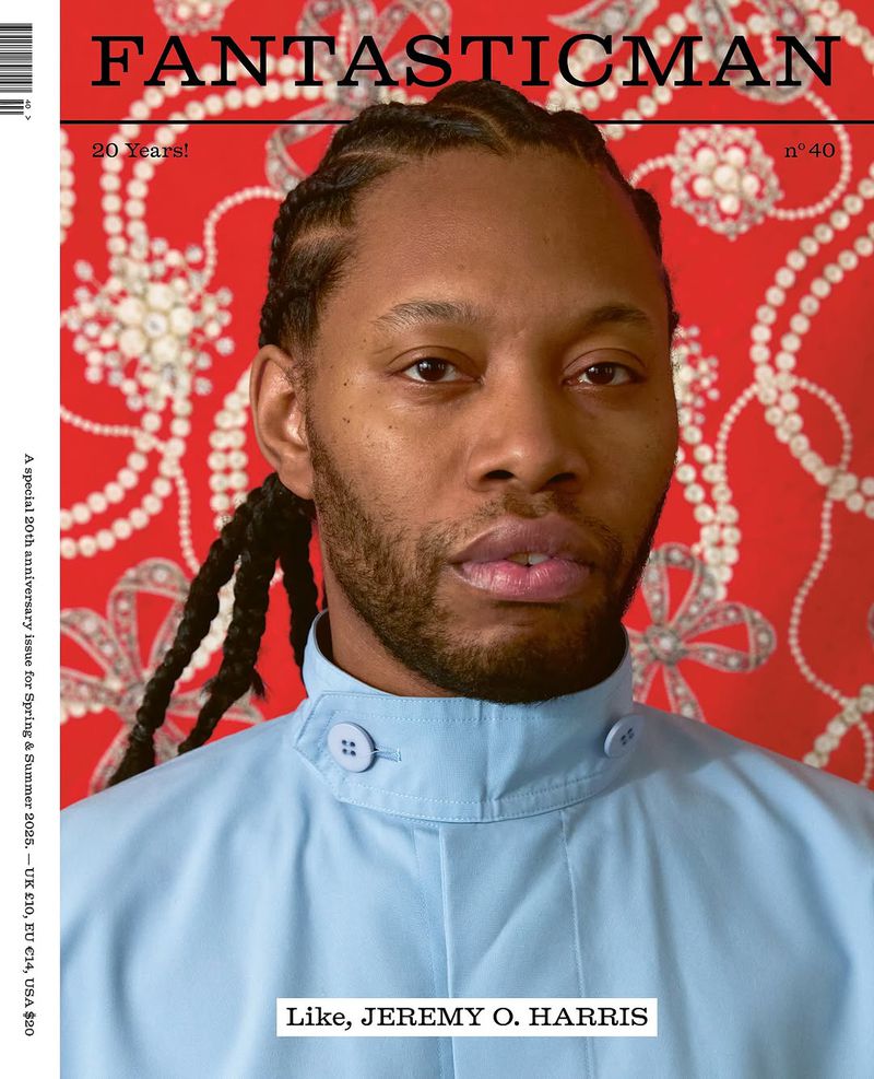 Close-up portrait of Jeremy O. Harris, an adult male with dark hair and skin, wearing a light blue collared shirt on a magazine cover.