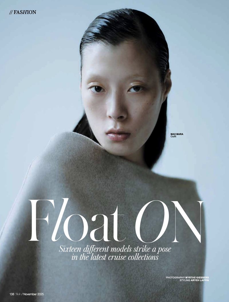 Fashion magazine cover featuring an Asian female model with slicked-back dark hair, wearing a tan draped garment, against a light background.