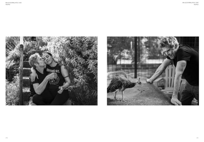 Two people embrace outdoors in a black and white portrait; a man leans against a table next to a peacock in an outdoor setting.