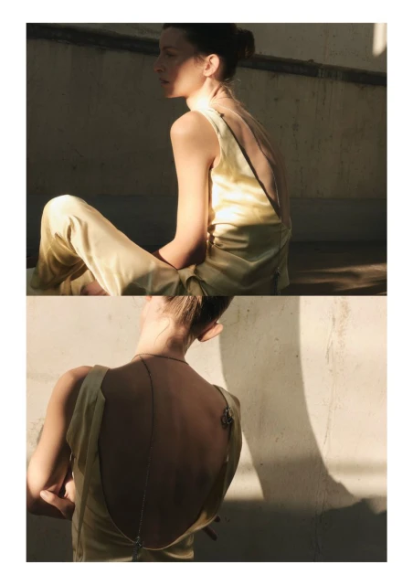 A woman in a light yellow sleeveless top and pants sits on a concrete surface in natural sunlight, presented in a split-level perspective.