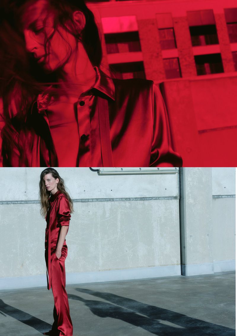 A woman in a red satin jumpsuit poses in an urban setting with a split-screen of red and natural lighting, showcasing fashion and style.