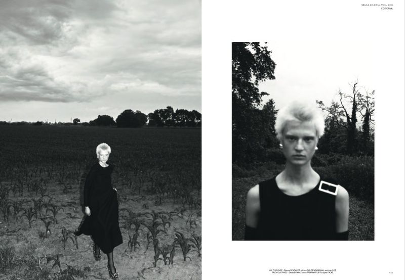 Monochrome fashion layout showing a model in a dark dress walking in a sparse field and a close-up portrait against trees.