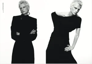 Model with short blonde hair in black apparel against a solid white background for Mia Le Journal editorial