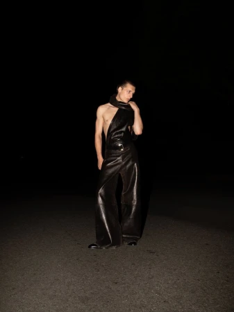 Model Colin Otto wearing black leather trousers and scarf in nighttime editorial photography for SSAW Magazine