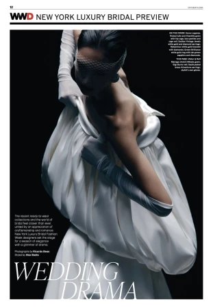Fashion editorial shot of a person in a white bridal gown with full gloves and a white veil against a dark background, WWD cover.