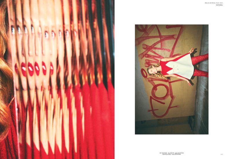 Editorial fashion shot featuring an adult female model in a red and white dress lying next to graffiti. Close up shot of a woman's face with multiple reflections.