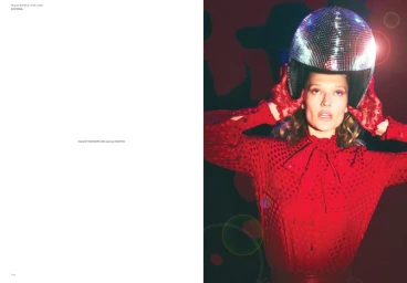 Model Toni Garrn wearing a sequined disco ball helmet and red blouse for Mia Le Journal photographed by Guy Aroch.