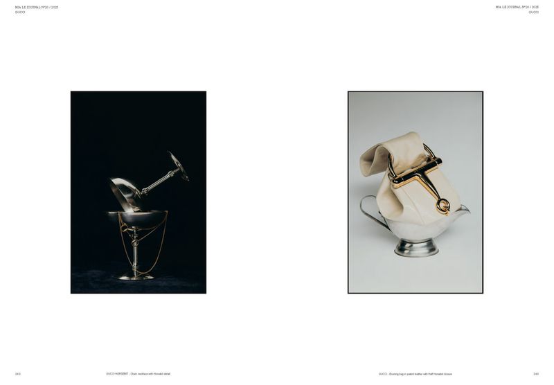 Still life of a silver martini glass on a pedestal with gold chain, and a white leather bag in a silver gravy boat.