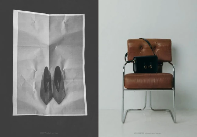 Split editorial composition with a folded poster of pointed shoes beside a black leather handbag resting on a brown leather armchair.