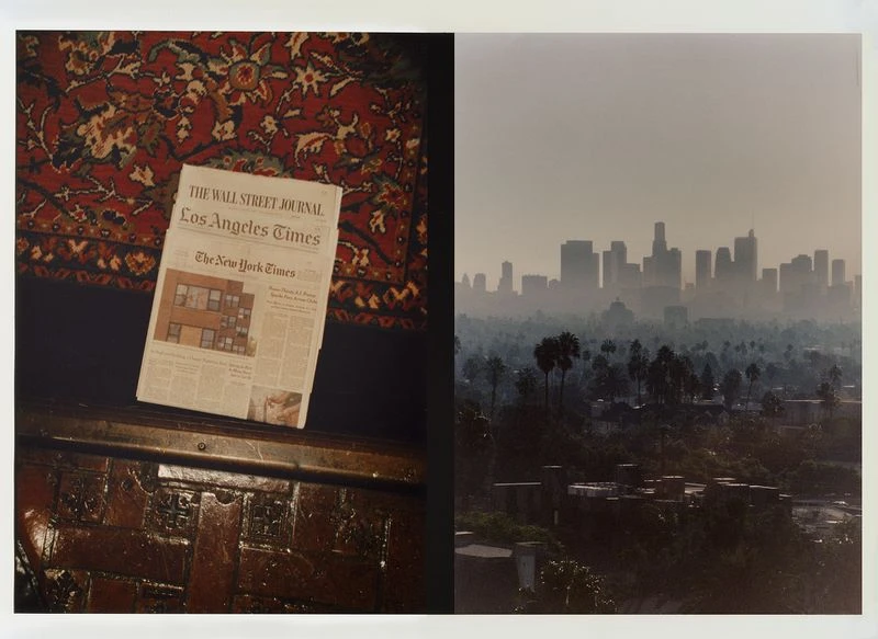 Split-view of newspapers on wood and Los Angeles skyline with palm trees in haze, evoking urban information and landscape.