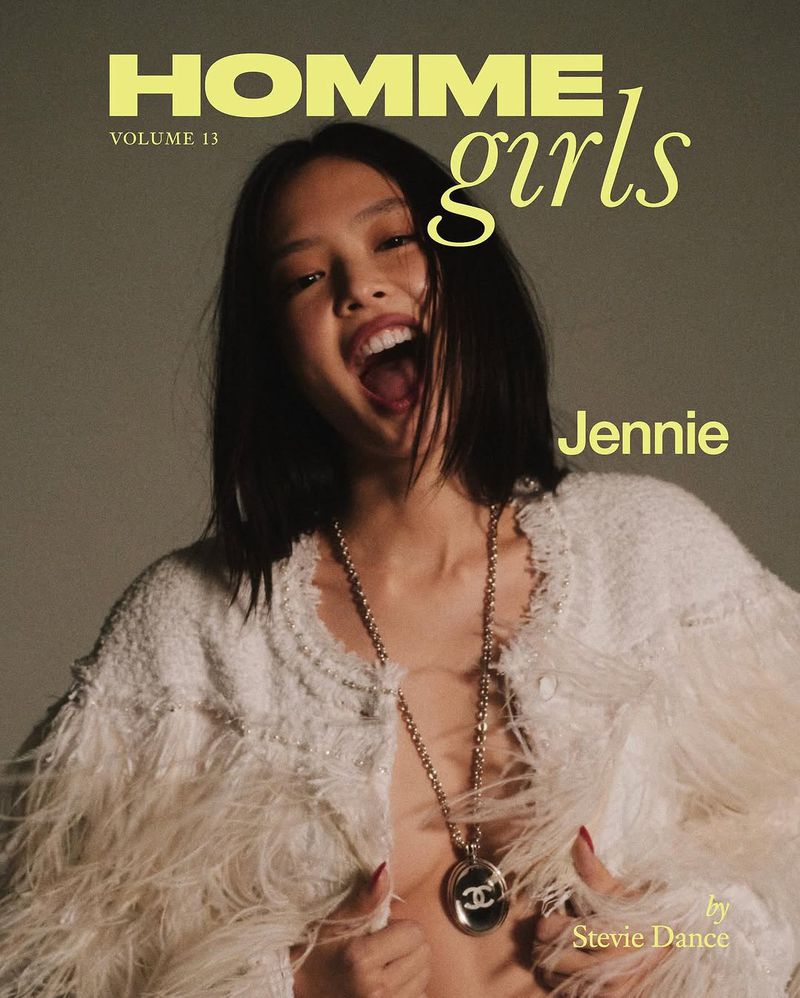 Magazine cover featuring an Asian female model in a textured white jacket with feather trim and a Chanel pendant. Editorial fashion shot.