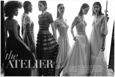 Black and white editorial image of six female models wearing elegant evening gowns in a bright studio setting.