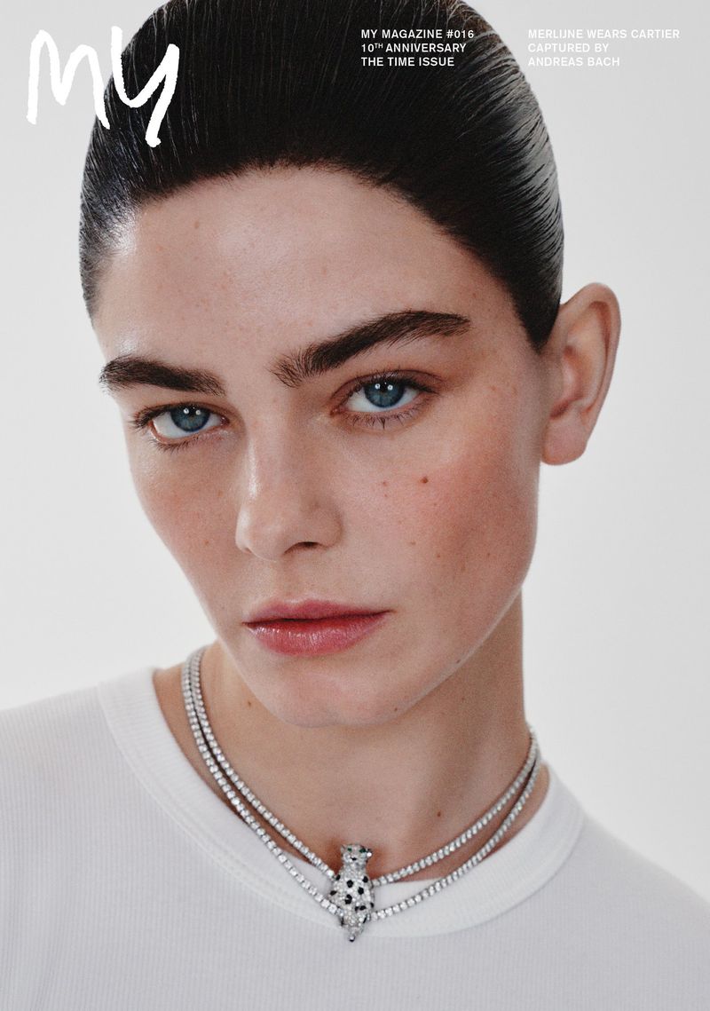 Close-up of an adult female wearing a Cartier necklace, featured on the cover of My Magazine, against a light neutral backdrop.