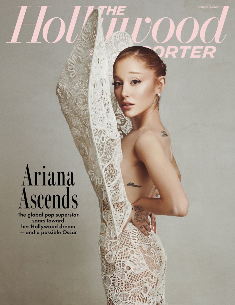Ariana Grande graces The Hollywood Reporter cover, wearing a white lace gown, gazing at the camera with neutral expression, in photo studio.