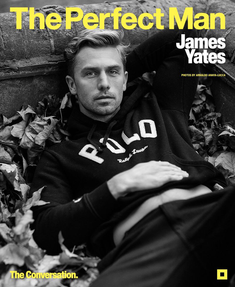 Magazine cover featuring a blond man wearing a Polo hoodie, reclining among fall leaves and concrete, with yellow sans-serif text.