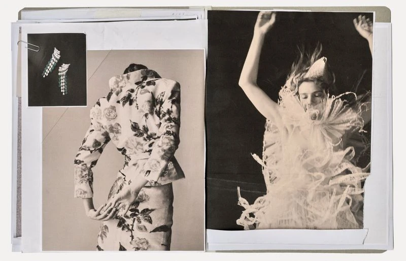 Fashion photos on a mood board featuring a floral suit and a woman in a white ruffled garment raising her arms in a dark room.