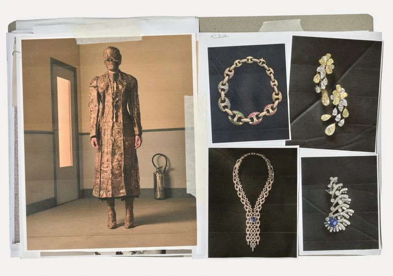 Fashion editorial featuring a person in textured coat and jewelry, plus jewelry product shots displayed on a binder with printed images.