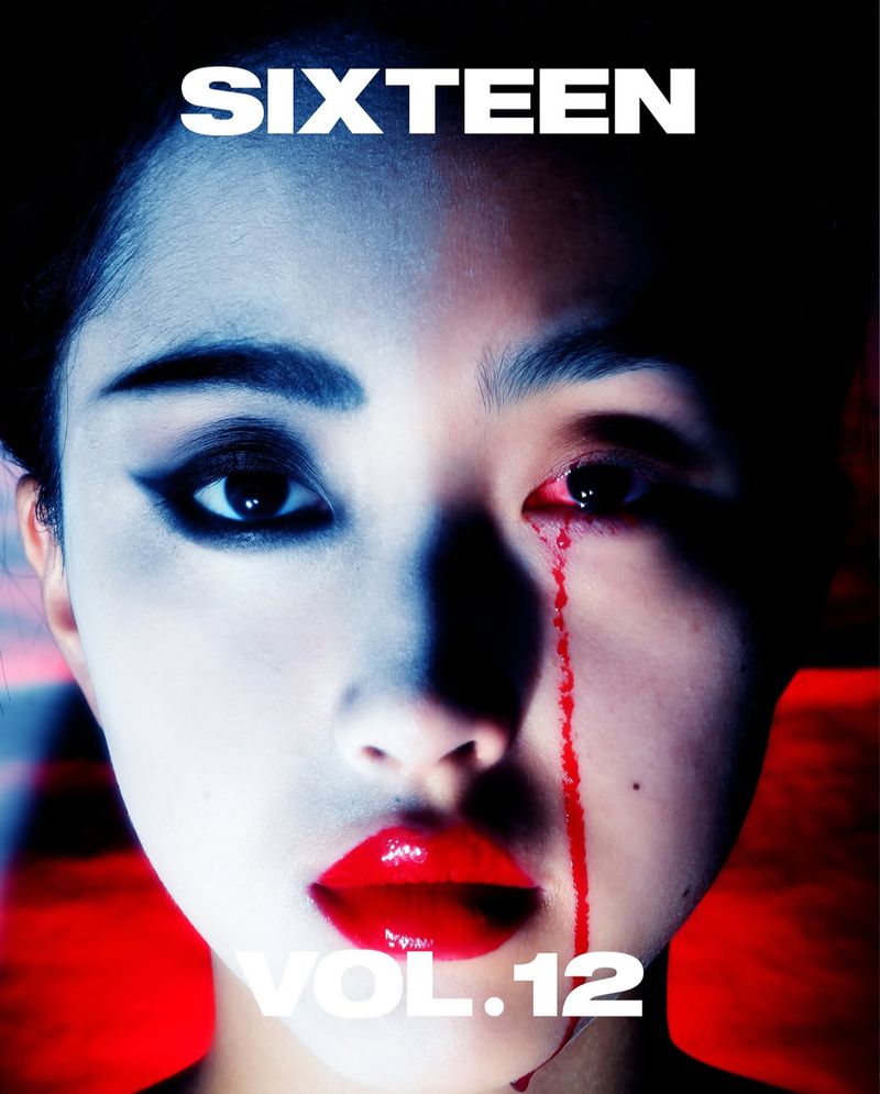 Artistic portrait of a woman with dramatic makeup and simulated blood, creating a striking and unconventional visual.