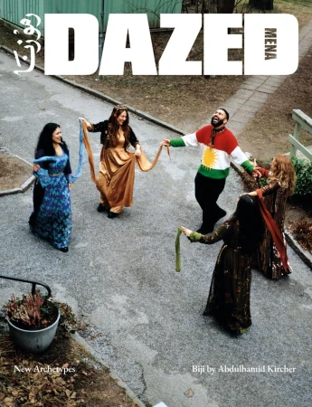 Magazine cover featuring a group of people in a circle in a courtyard, wearing colorful, traditional clothing, with DAZED magazine logo at the top.